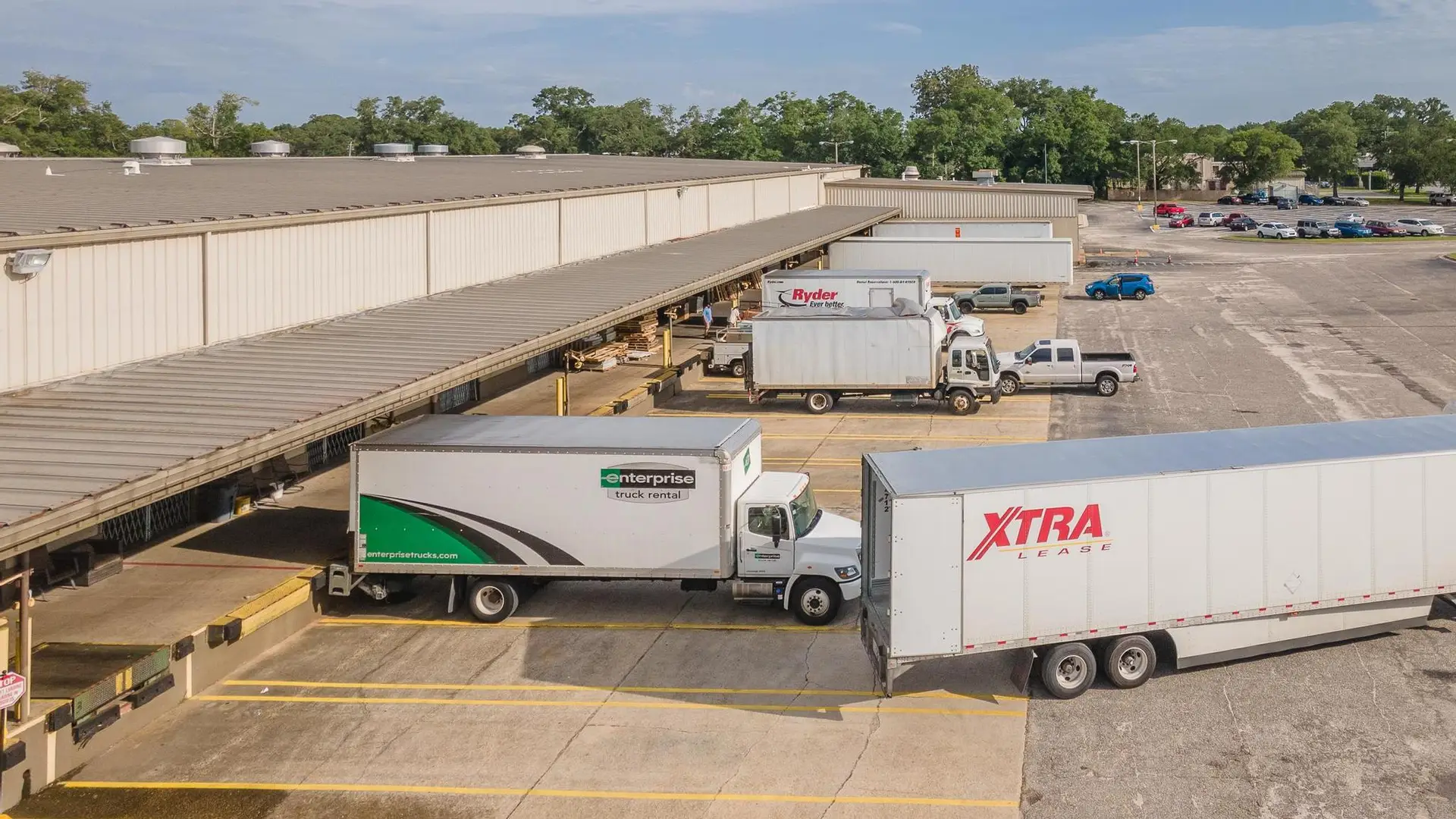 Trucks exiting warehouse bays at 7801 Sears Boulevard in Pensacola, a Northwest Florida industrial property.