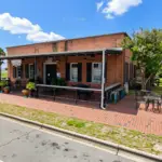 Pensacola Bay Brewery in historic downtown Pensacola, Florida, celebrating a long-term commercial lease renewal.